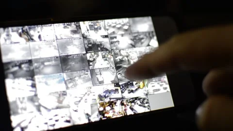 Surveillance security technology cctv on the phone monitor. split screen display Stock Footage 169702579