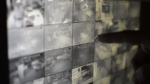 Surveillance security technology cctv on the phone monitor. split screen display Stock Footage 169702720