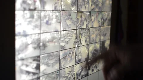 Surveillance security technology cctv on the phone monitor. split screen display Stock Footage 169702937