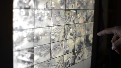 Surveillance security technology cctv on the phone monitor. split screen display Stock Footage 169703072