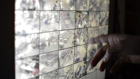 Surveillance security technology cctv on the phone monitor. split screen display Stock Footage 169703081