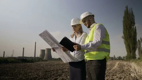 Survey young architect engineers team on energetic power plant completing ana Stock Footage 82177875