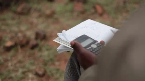 Surveyor calculating land with GPS coordinates, Kenya, close up Stock Footage 51219926