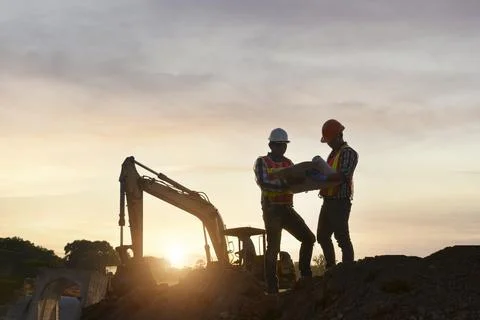 Surveyor engineer worker making measuring with theodolite on road works.surve Stock Photos