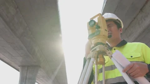 A surveyor engineers worker making measuring. Video stock 238432710
