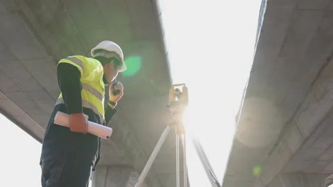 A surveyor engineers worker making measuring. Video stock 238432713