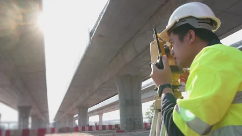 A surveyor engineers worker making measuring. Video stock 238432714