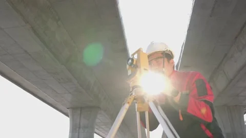 A surveyor engineers worker making measuring. Video stock 238432726