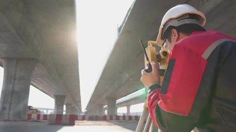 A surveyor engineers worker making measuring. Video stock 238432728