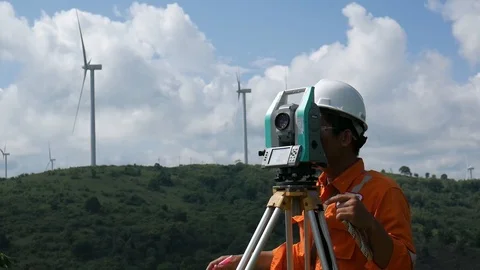 A surveyor using electronic theodolite to measure the land Stock Footage 124270148