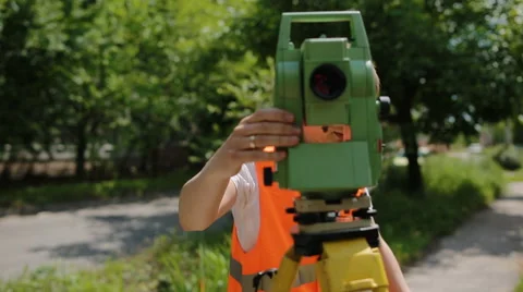 Surveyor at work measuring the distance Stock Footage 68191189