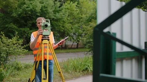 Surveyor at work measuring the distance Stock Footage 68401768