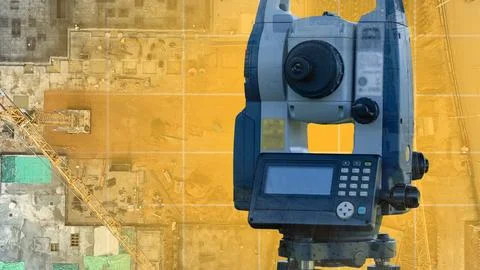 Surveyor's device dominates the frame, precise and powerful Stock Photos