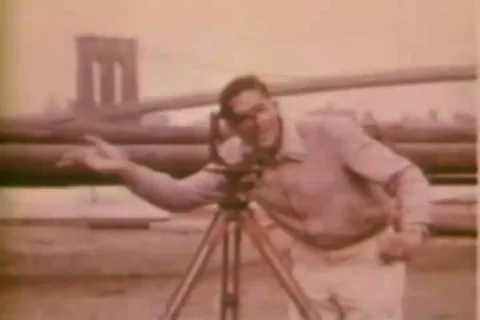 Surveyors work on a road project and study blueprints and work on a bridge- 1958 Stock Footage 106709535