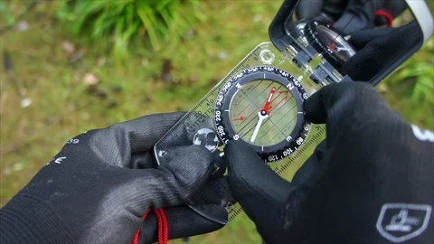 Survival compass for navigation and finding directions in Nature Video stock 111856229