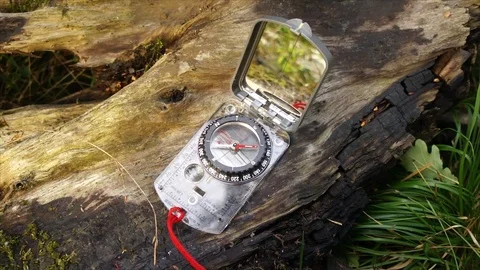 Survival compass for navigation and finding directions in Nature Stock Footage 111856441