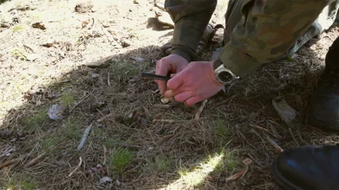Survival - lighting the fire with magnesia flint. Stock Footage 88241189