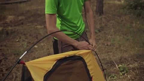 The survivalist sets up a tent Stock Footage 161481923