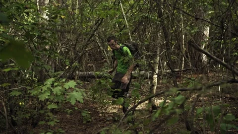 Survivalist Walking through Forest in 4k Stock Footage 161485846