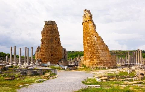 Surviving Hellenistic gate towers and Corinthian column in Perga, Turkey Stock Photos