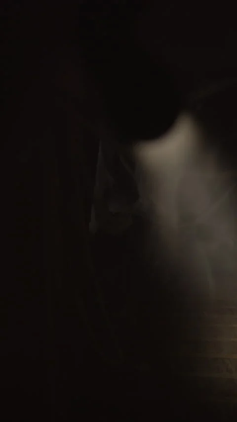 Survivor with flashlight walking in dark corridor with spider web looking Stock Footage 315057845