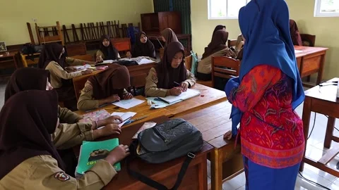 Susana learns in the classroom Stock Footage 243627520