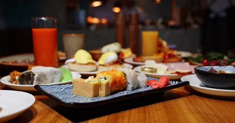 Sushi and Breakfast Buffet Spread at Luxury Hotel Restaurant Video stock 329052634