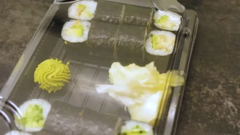 Sushi and rolls set in a plastic box. Delivery service, food stock footage Stock Footage 239057486