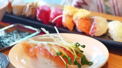 Sushi and sashimi on the table Stock Footage 296536671