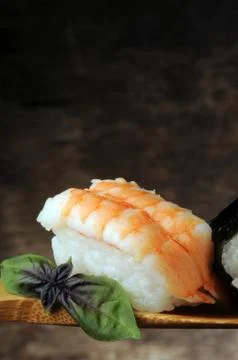 Sushi with basil on the spoon  Stock Photos