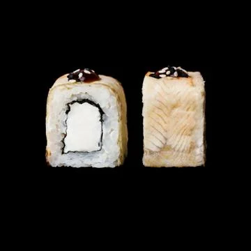 Sushi. Canada roll with eel and cream cheese, isolated in black background Stock Photos