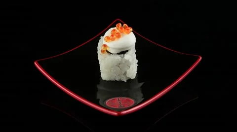 Sushi with caviar on black plate rotating (loop) Stock Footage 55637757