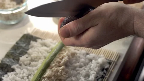 Sushi chef clicing open fresh avocado Stock Footage 92228422