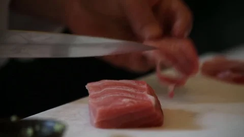 Sushi chef close up cutting fish Stock Footage 77605349