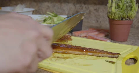 Sushi chef cutting eel Stock Footage 131932217
