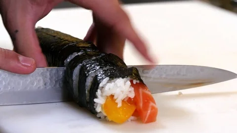 Sushi Chef Cutting Salmon Peach Futomaki Roll Video stock 80557548