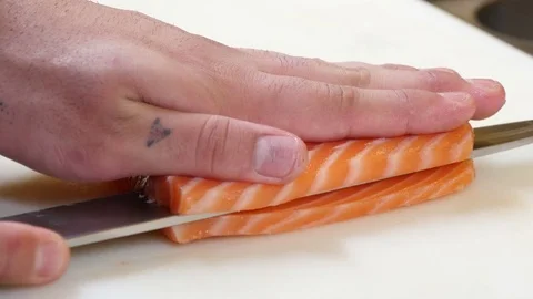 Sushi Chef Cutting a Salmon Steak Japanese Style Stock Footage 80557187