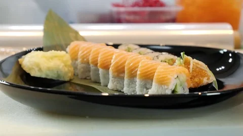 Sushi chef decorates sushi set Stock Footage 84698105