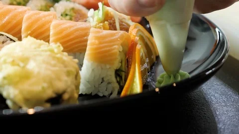 Sushi chef decorates sushi set Video stock 84699281