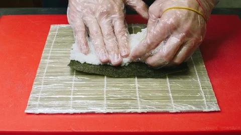 Sushi chef demonstrating skill. Serving sushi in a white plate in 4k resolution Stock Footage 111566985