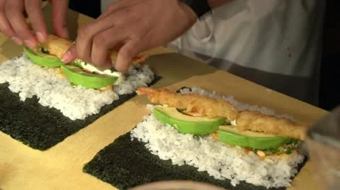 Sushi chef making a maki roll Stock Footage 22238856