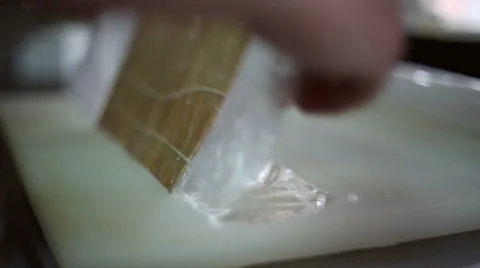 A sushi chef prepares the bamboo mat to tighten the roll Stock Footage 59698114