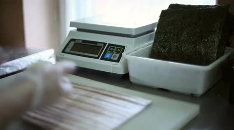 A sushi chef prepares rolls Stock Footage 59698518