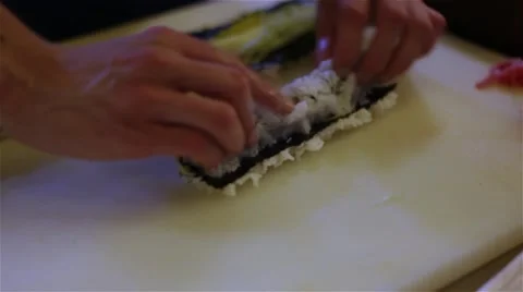 Sushi chef prepares rolls HD video. Master hands rolling up. Japanese cuisine Stock Footage 67487900