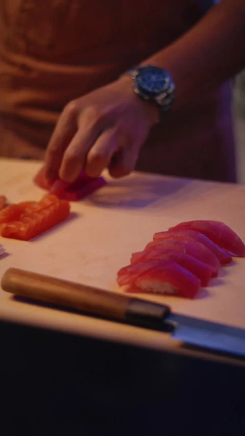 Sushi chef preparing authentic tuna nigiri 4K vertical video Stock Footage 317408623