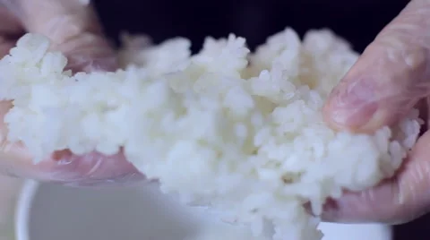 Sushi chef preparing rice for sushi roll Stock Footage 62922744