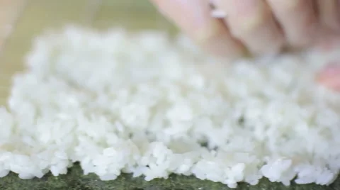 Sushi chef preparing rice for sushi roll in studio Stock Footage 62932428