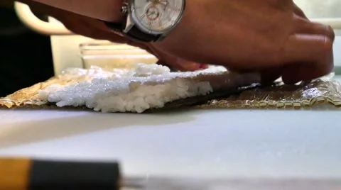 Sushi Chef Preparing Salmon Peach Futomaki Roll. A sushi-man cooking Stock Footage 64673574