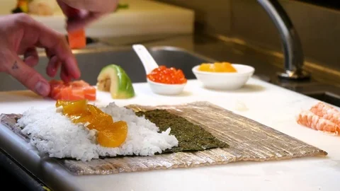 Sushi Chef Preparing Salmon Peach Futomaki Roll Video stock 81405822