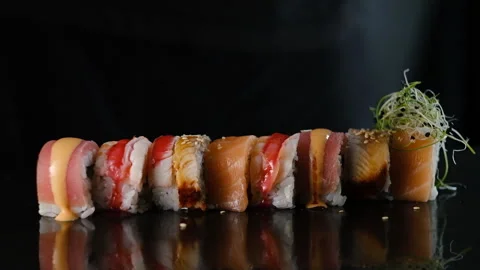 The sushi chef puts microgreens on top of the sushi. The chef prepares sushi. Stock Footage 161834633